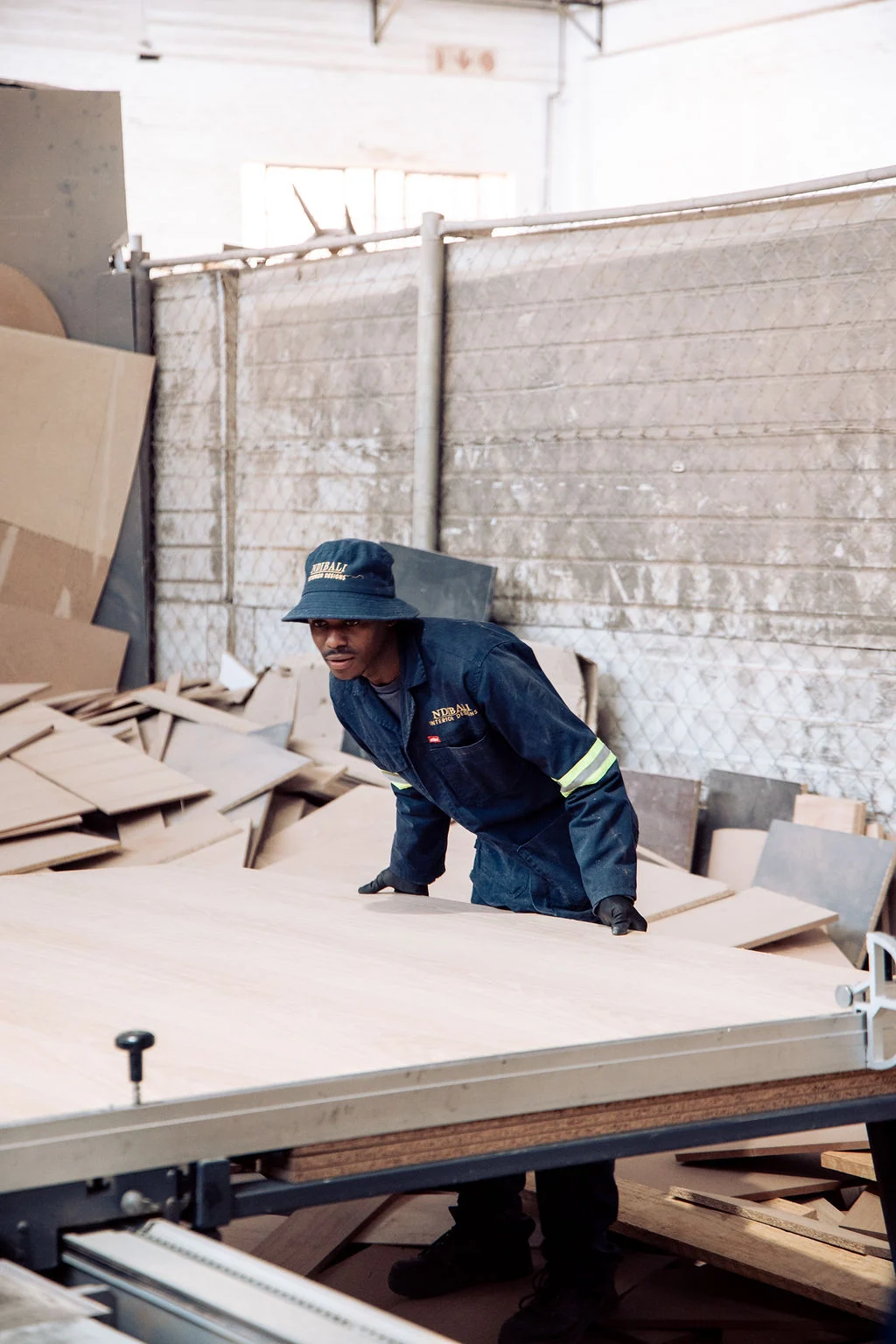 Ndibali artisan crafting custom furniture at the Johannesburg workshop